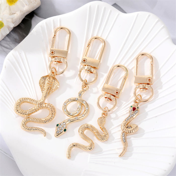 Gold Tone Sculpted Snake and Cobra Shape Clip Keychains
