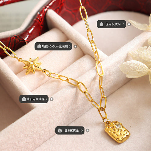 Gold star and textured square pendant close-up with printed labels