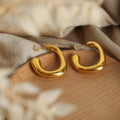 Bold Sculpted Open Hoop Earrings in Polished Gold Tone view 3
