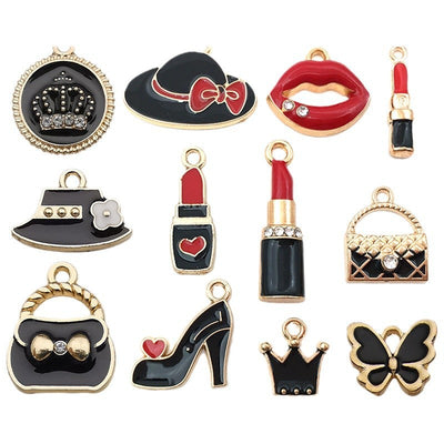 Black assorted shape charms arranged on a light background