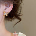 Sculpted Openwork Butterfly Stud Earrings in Gold Tone view 4