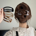 Large Translucent Open Oval Hair Pins In Light Tan Or Tea Brown view 1