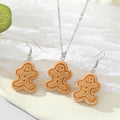 Silver Tone Gingerbread Figure Pendant Necklace and Hook Earrings view 1