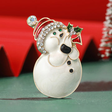 Pearlescent Snowman Brooch With Faceted Crystals And Polished Metal Details