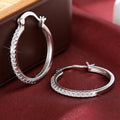 Silver Tone Thin Round Hoop Earrings with Clear Pavé Front view 2