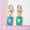 Gold Tone Wavy Rectangle Resin Evil Eye Clip Keychains in Six Colors view 5