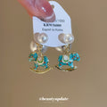 Pearl and Blue Enamel Rocking Horse Stud Earrings Jewelry Design view 2