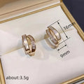 Gold Tone Layered Geometric Crystal Huggie Hoop Earrings view 4