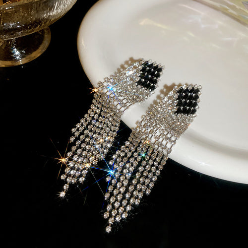 Black and White Crystal Fringe Stud Earrings shown in a styled or display view