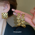 Gold Tone Three Plate Necklace With Small Black Flower Pattern view 2