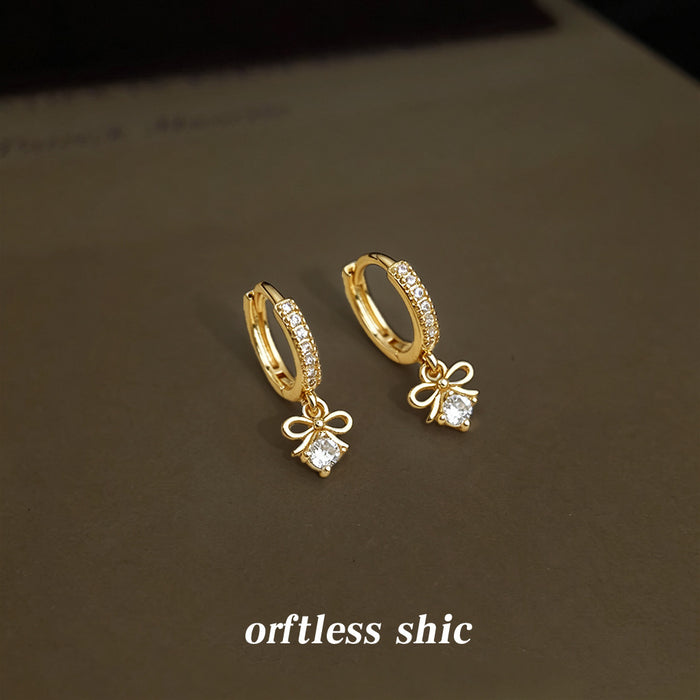 Gold Tone Crystal Pave Huggie Hoop Earrings Bow Drop