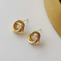Sculptural Knot Stud Earrings In Gold And Silver Tones view 6