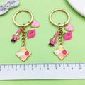 Flower Charm Keychains Featuring Magenta Lipstick Across 43 Pictured Variations view 4