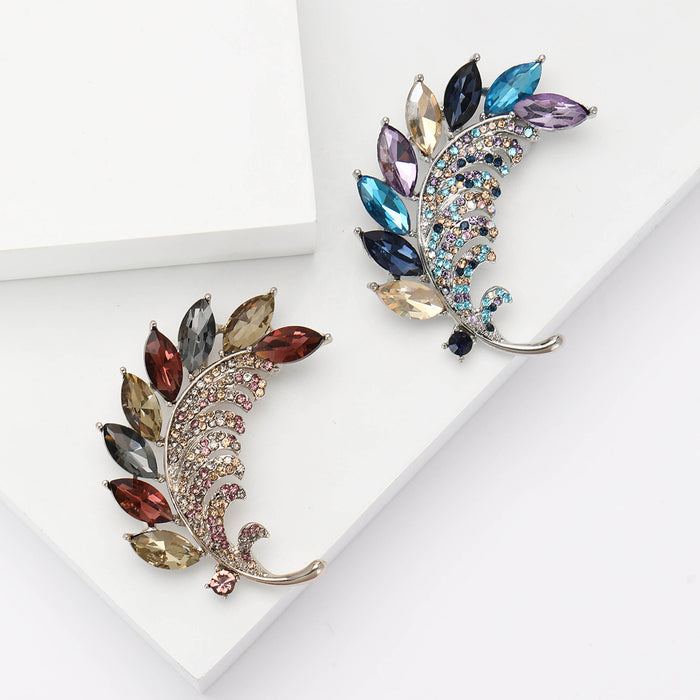 Marquise Crystal Leaf Brooch With Polished Metal And Sculpted Decorative Details