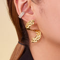 Hammered S Curve Statement Stud Earrings in Polished Gold Tone view 4