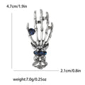 Skeleton Hand Brooch With Jeweled Ring and Ornate Cuff view 6
