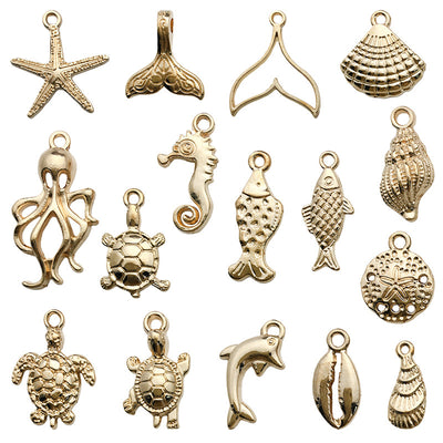 Yellow turtle and octopus charms arranged on a light background
