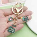 Christmas Charm Keychains Featuring Green Butterfly Across 81 Pictured Variations view 3