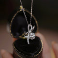 Silver Tone Bow Pendant Necklace Clear Center Stone view 1