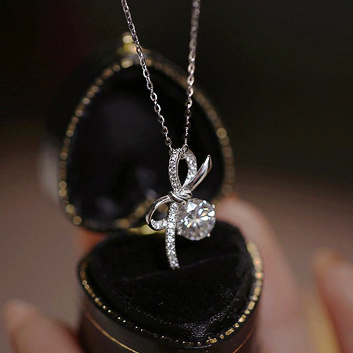 Silver Tone Bow Pendant Necklace Clear Center Stone