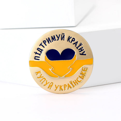 Angled display of Blue and Yellow Dove Emblem brooch