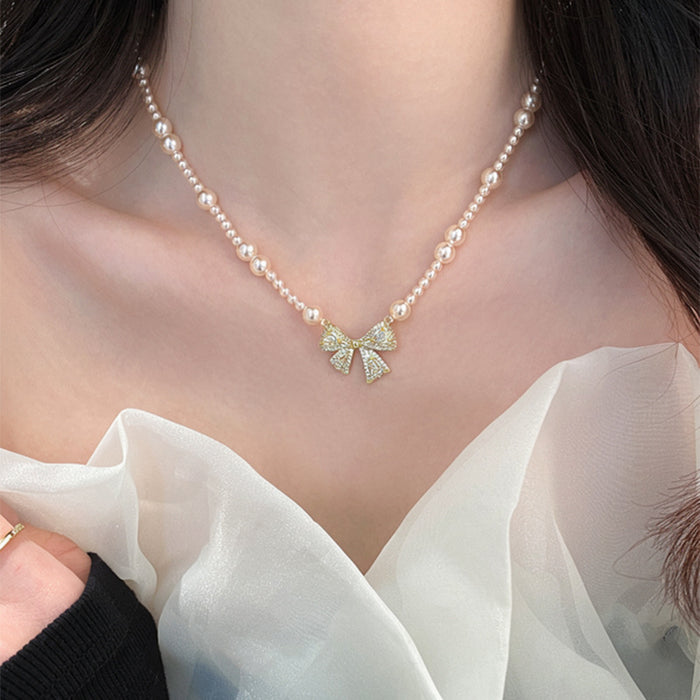 Pink Pearl Strand Necklace With Crystal Bow Pendant