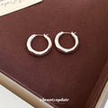 Rounded Sculpted Hoop Earrings In Gold And Silver Tones view 4
