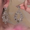Silver Crystal Teardrop Cluster Stud Earrings with Polished Metal Details view 3
