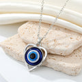 Heart Outline Blue Evil Eye Pendant Necklaces in Two Finishes view 4