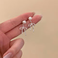 Pearl Bow Stud Earrings with Delicate Short Chain Tassels view 6