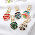 Gold Tone Enamel Monstera Leaf Clip Keychains in Five Colorways view 1