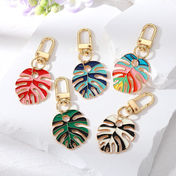 Gold Tone Enamel Monstera Leaf Clip Keychains in Five Colorways