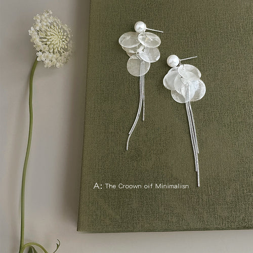 Silver-tone white-pearl translucent-disc chain-tassel earrings in the first product display.