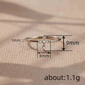 Tiny Cross Clear Stone Ring In Three Polished Metal Tones view 4