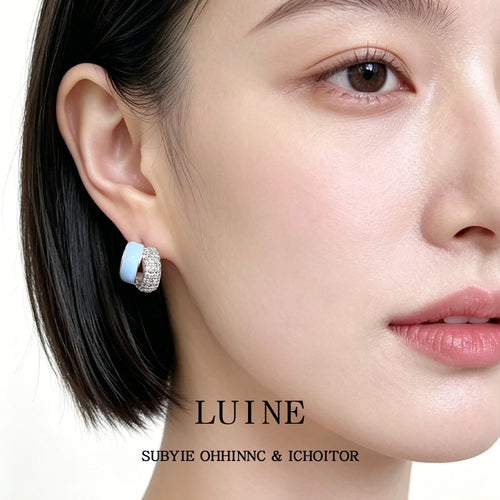 Model wearing light blue enamel crystal half hoop stud