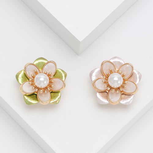 Front view of layered translucent camellia petals surrounding a pearl center
