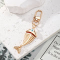 Gold Tone Fish Skeleton Evil Eye Clip Keychains in Five Colors view 4