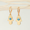 Gold Tone Hamsa Evil Eye Huggie Drop Earrings with Enamel Detail view 1