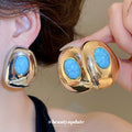 Blue Oval Resin Stud Earrings in Gold and Silver Tones view 2