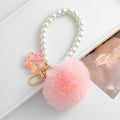 Pink Faux Fur Pom Keychain with Pearl Strand and Glitter Flower Charm view 5