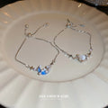 Silver Tone Star Bracelet With Blue Moon Or White Heart Center view 3