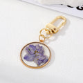 Gold Tone Pressed Flower Resin Clip Keychains in Eight Round and Irregular Designs view 6