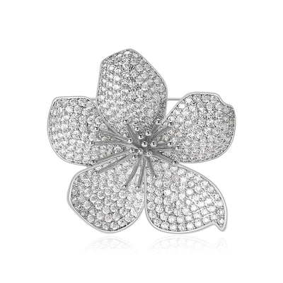 Front view of a rounded five-petal flower covered in clear pavé stones