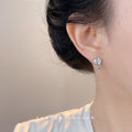 Silver Tone Large Clear Oval Stone Small Blue Stone Stud Earrings view 2