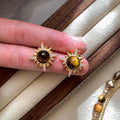 Gold Tone Sunburst Stud Earrings with Brown Stone Style Centers view 2