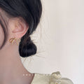 Minimal Wire Bow Stud Earrings Gold and Silver Tones view 2