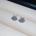 Silver Snowflake Stud Earrings with Blue Crystal Centers view 6