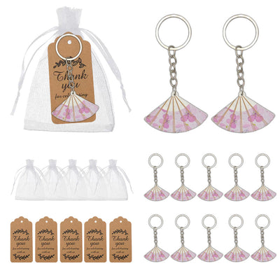 A package overview shows pink fan keychains, white drawstring bags and brown thank-you tags.