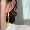 Brushed Wavy Ribbon Drop Stud Earrings in Gold and Silver view 6