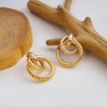 Twelve Gold Tone Sculptural Knot and Hoop Earrings view 4